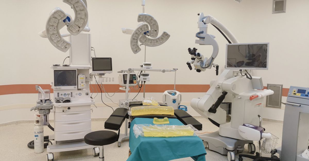 A state-of-the-art operating room fully equipped with advanced medical devices and surgical tools.